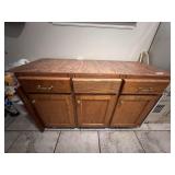 Laundry… Wooden cabinet, some content, has three doors and two drawers for storage, see pictures for details.