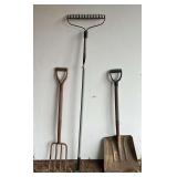 Snow shovel, pitchfork and yard rake