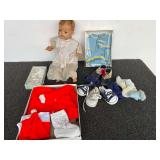 Assorted baby items to include shoes, sweater, infants knit set, and a vintage composition doll, see pictures for details.