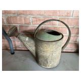 Vintage galvanized watering can, see pictures for details.
