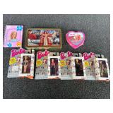 Assorted Barbie keychains, Barbie collectible tin, and more. See pictures for details.