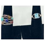 Ladies rings, both pieces are stamped 925, includes one with a unique stone that resembles Larimar, and a multistone ring featuring stones that resemble turquoise, lapis lazuli, tiger eye, and more. S