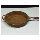 Lodge cast-iron frying pan, this piece will need cleaning and re-seasoning, see pictures or details.