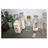 Vintage jars and milk jars, also includes a vintage honey jar with embossed beehive decoration, approximately nine pieces, see pictures for details.