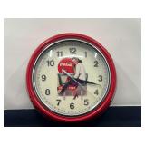 DEN… Metal framed battery powered Coca-Cola clock, see pictures for details.