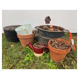 Eight planter pots in plastic flat stands