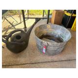 Galvanized tub with metal washboard, also includes a watering can, see pictures for details.