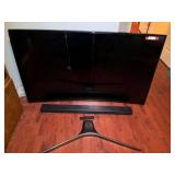 BR3… Samsung 65” television with sound bar and remote, powers up, with stand, see pictures for details.