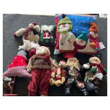 Assorted Christmas decor to include stuffed snowman, Santa, Christmas pillows, and more. See pictures for details.