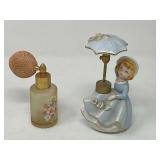 Vintage DeVilbiss figural porcelain perfume atomizer bottle featuring a girl with an umbrella and flowers. Also includes a vintage frosted glass perfume atomizer with a floral design. Tub is not inclu