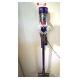 Laundry…Battery powered Dyson vacuum cleaner, comes with mount and charger, powers up, see pictures for details