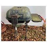 Portable rolling charcoal grill