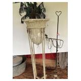 Tall metal plant stand and vintage lamp