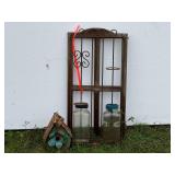 Vintage repurposed trellis in birdhouse with two glass jars