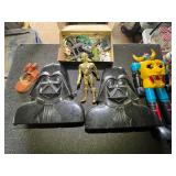 Star Wars memorabilia to include Darth Vader storage cases, set of two with assorted action figures, and more. See pictures for details.