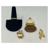 Vintage Avon jewelry to include a pendant, pins, and a ring. See pictures for details.