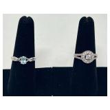 Ladies rings, both pieces are stamped 925, includes a lovely cluster ring, and one with a blue stone that resembles blue topaz, see pictures for details.