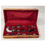 Small jewelry box filled with ladies fashion estate jewelry to include assorted rings, pendant, earrings, beaded bracelet, and more. See pictures for details.