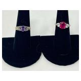 Ladies silver rings, both pieces are stamped 925, includes one with a ruby colored stone flanked by two heart shaped clear stones, also includes one believed to be amethyst with marcasite accents, see