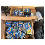 Large assortment of Hot Wheels, still new in the package, see pictures for details.