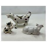 LR… Cow figurines, also includes a cow creamer, three pieces total, see pictures for details.