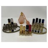 Vintage lipstick holders, two with mirrored trays, also includes a frosted pink perfume bottle with bulb, see pictures for details. ￼