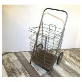 DEN… Vntage metal rolling shopping cart, see pictures for details.
