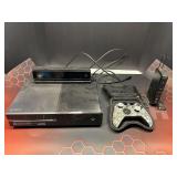 Assorted items to include an Xbox one console, working condition unknown, assorted cords, desk mat, and more.