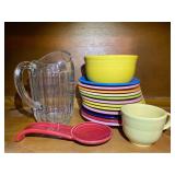 KIT… Assorted Fiestaware to include salad plates, bowl, cup, spoon rest, also includes a vintage glass pitcher, see pictures for details.