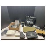 DEN… assortment of firearm accessories to include a red laser site, small assortment of ammunition, soft sided pistol cases, and more. Tub is not included, see pictures for details.