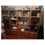 BR3…Large three-piece entertainment armoire, one of the short glass doors has been removed but is included, items shown in pictures are sold in separate lots, see pictures for details.