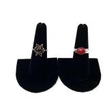 Ladies sterling silver rings, one is stamped 925, includes one with a red stone, believed to be red coral, and one stamped sterling with a cluster of red stones, believed to be garnet, see pictures fo