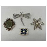 Beautiful border brooch with lovely blue stones, dragonfly brooch, flower cluster brooch, and a vintage glass cameo brooch, see pictures for details.