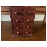 DEN… Vintage small wooden spice/apothecary wall mount chest. Has six drawers, see pictures for details.