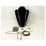 Ladies fashion estate jewelry to include goldtone necklace, faux pearl necklace, fashion bracelet, and fashion earrings. See pictures for details.