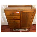 BR4… Vintage children’s nursery chifforobe, with content, has five drawers with side cabinet, and wooden wheels. See pictures for details.