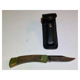 BR1…Buck 110+ pocket knife with belt sheath, see pictures for details.
