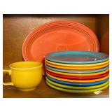 KIT… Shelf lot marked 1135 to include small Fiestaware dinner plates, platter, and more. See pictures for details.