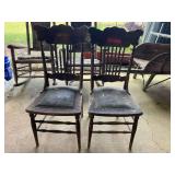Antique spindle back chair with a carved back and a studded leather seat, set of two, these chairs are well worn, and need some TLC. See pictures for details.
