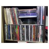 BR2…Large assortment of empty CD/DVD cases, also includes a large stack of CDs/DVDs, not sure if they all match the empty cases, see pictures for details.