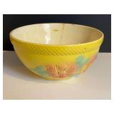 LR… Vintage ceramic oven proof mixing bowl, believed to be vintage Hull “Sun Glow” with embossed floral motif, this piece does have a crack, see pictures for details.
