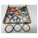 Collectible cigar box filled with assorted ladies fashion estate bracelets, see pictures for details.