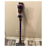 BR2… Dyson battery powered light duty vacuum cleaner, does power up, needs charging cord, see pictures for details.