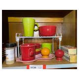 KIT… Shelf lot marked 1134, to include assorted Fiestaware berry bowls, bowl, cups, salt and pepper shaker, and more. See pictures for details.