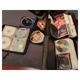 BR2…Large DVD/CD assortment, comes with carrying cases, see pictures for details.