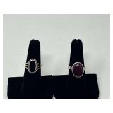Sterling silver rings, two pieces, both pieces are stamped 925, includes one with a faceted ruby colored stone, and one, believed to be onyx with a rope twist bezel, see pictures for details.