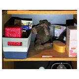 BR3…Shelf lot marked 1550, includes all content of shelf. Includes a skillet wind chime, teddy bear, high heel tape dispenser, and more. See pictures for details.