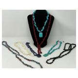 Assortment of ladies beaded necklaces, stones resemble turquoise, red coral, mother-of-pearl, and Moore. See pictures for details.