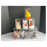 Beanie baby assortment, comes with eight display cases, see pictures for details.