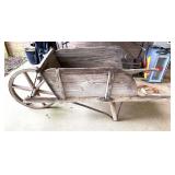 Antique wooden wheelbarrow, see pictures for details.